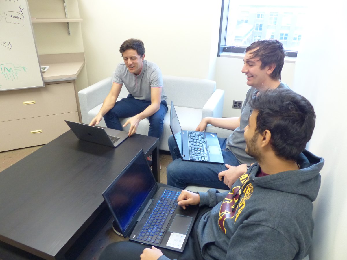 Mattia and students meeting with laptops