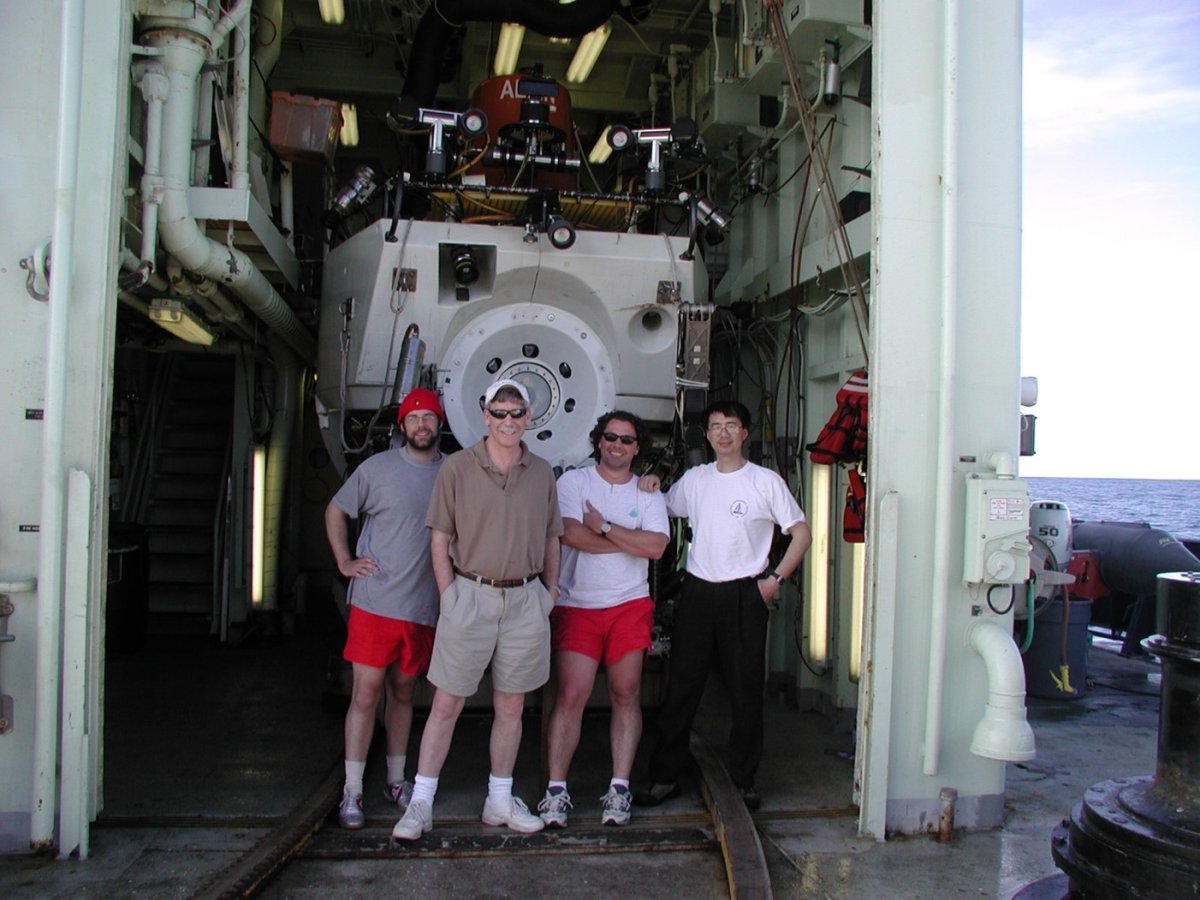 Seyfried with graduate students Nick Pester (Ph.D., 2012, left), Dionysis Foustoukos (Ph.D., 2005, right) and Research Associate Dr. Kang Ding (far right) at sea in advance of DSRV Alvin dives to seafloor hydrothermal vents at EPR 9°N.