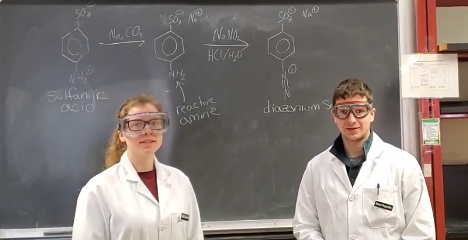 Teaching assistants Rachel Dunscomb and Aaron Reynolds prepare for an organic chemistry experiment.