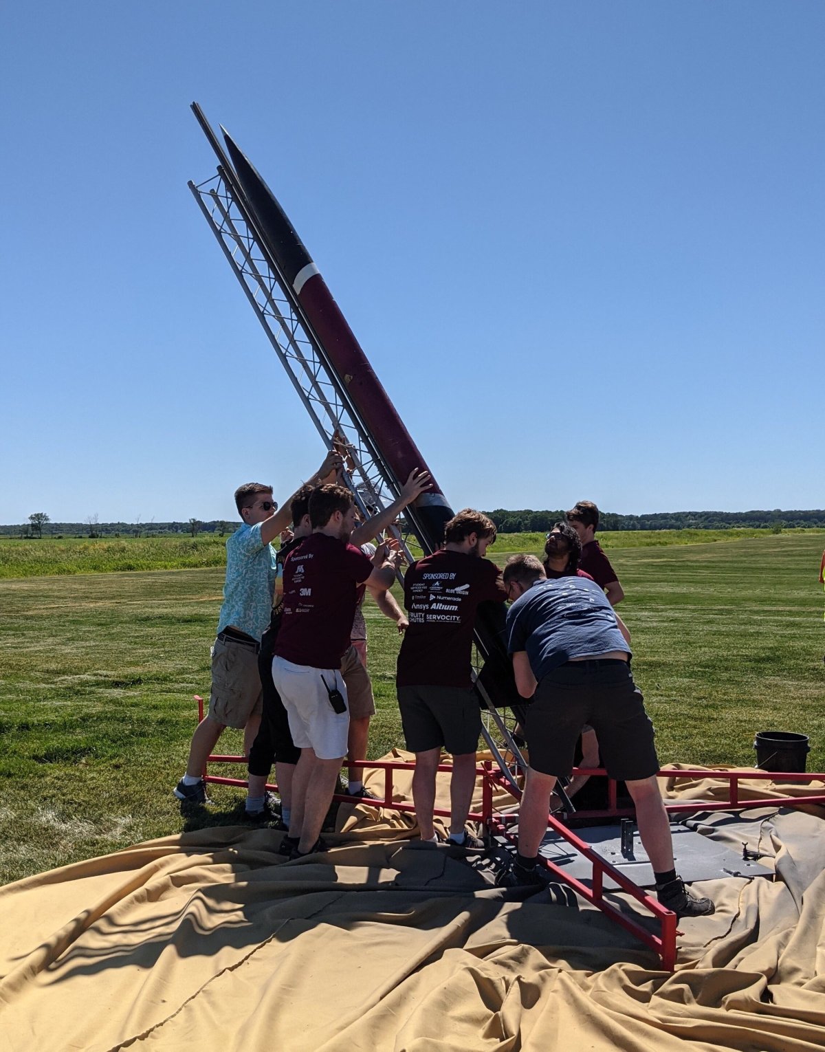 Rocket Team members preparing their rocket for launch