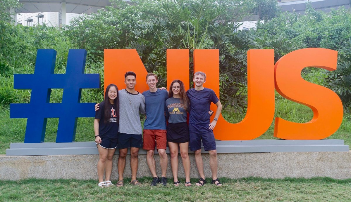 UMN students in front of NUS sign