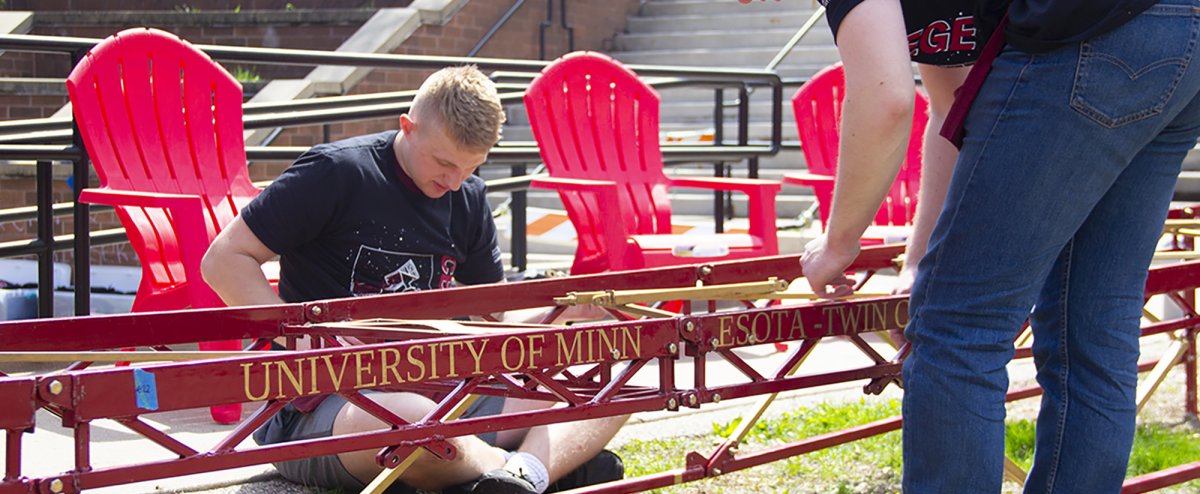 Students build the competition Steel Bridge model in the Civil Engineering courtyard