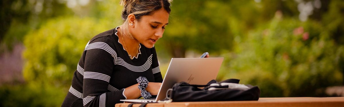 student-laptop-outside