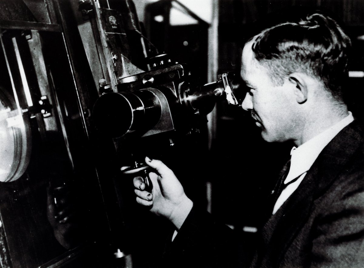 Clyde Tombaugh in 1938 at the Ziess blink microscope where he spent more than 7,000 hours.
