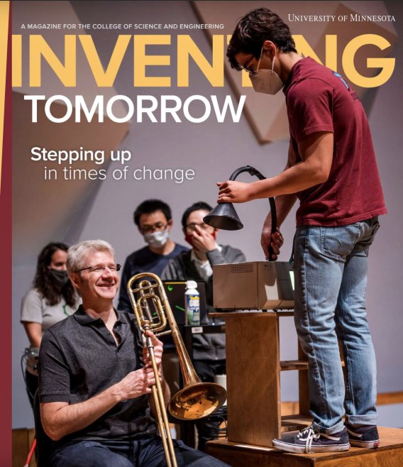 A student standing on a chair in front of a musician; cover of the Winter 2021 Inventing Tomorrow magazine