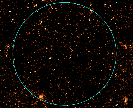 a section of an radio image from MeerKAT, with the circle showing the size of the full Moon.  Each picture from the telescope covers an area of more than 16 full Moons. SAURON can be seen as a smudge in the bottom left corner of the circle.