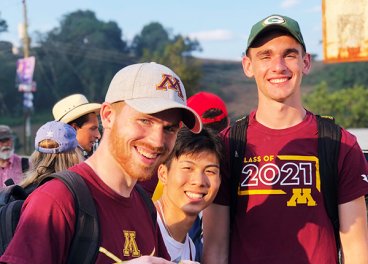 Two UMN students with Guatemalan person