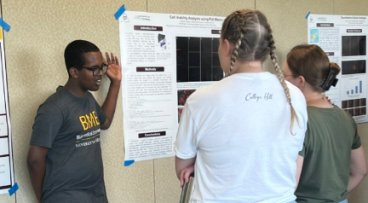 Student presenting research at conference