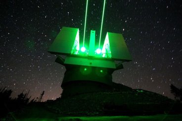 The Large Binocular Telescope with its lasers engaged.