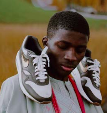 Taoheed Bayo with his Afro-Yute Sneakers