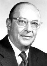 Black and white photo of person wearing glasses
