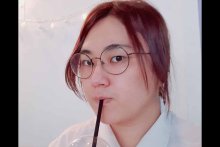 Haru K. Park headshot drinking from black straw