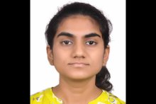 Jyotsna Gidugu headshot on white background in yellow shirt