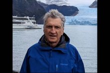 Leonid Glazman headshot with glacier 