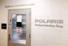 The Polaris and Anderson Lab signs by a door.