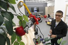 Student working with robot in a lab