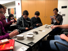Students playing Cards Against Humanity at a game night