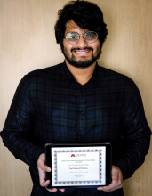 Data science student Sai Kumar Kayala holds his award for Best Project