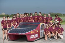Solar vehicle project team photo with their car