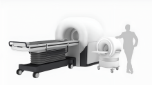 Rendering showing Adialante scanner 1/10th the size of a traditional MRI scanner, with person icon for scale