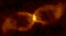 CK Vulpeculae, an hourglass-shaped remnant of a collision between a white and brown dwarf