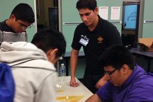 Two SHPE students conducting a K-12 outreach program