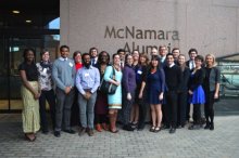 Acara Challenge participants standing in front of McNamara Alumni Center