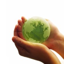Small green globe held in hands