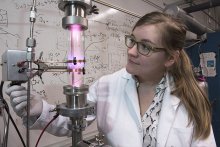 University of Minnesota researcher Samantha Ehrenberg uses a plasma reactor to create silicon nanoparticles
