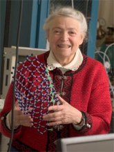 Mildred Dresselhaus holding up a model of nanomaterial