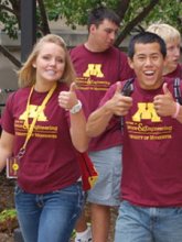 two freshman students with their thumbs up