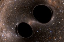 Graphic of two black holes merging in space
