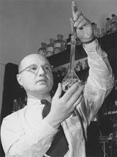 black and white photo of Izaak M. Kolthoff with beaker