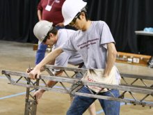 competitors building a steel structure