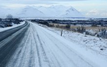 Photo of snowy paved road
