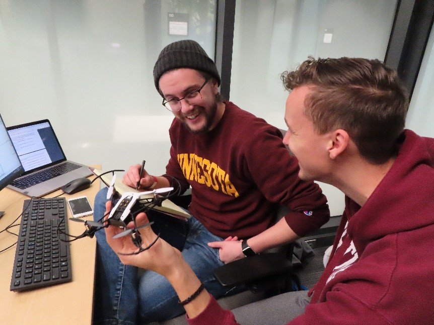 Two students working on drone research