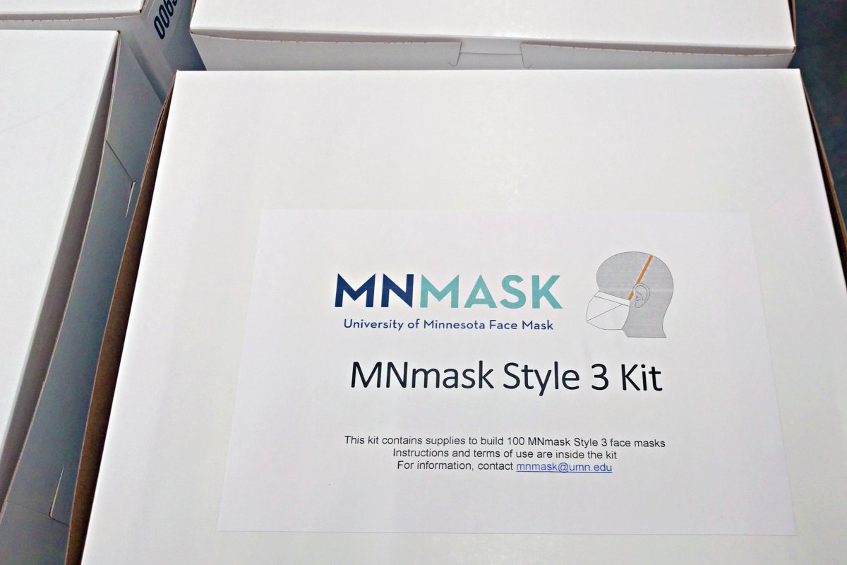 A white box with a sticker that states University of Minnesota face mask MNmask Style 3 kit.