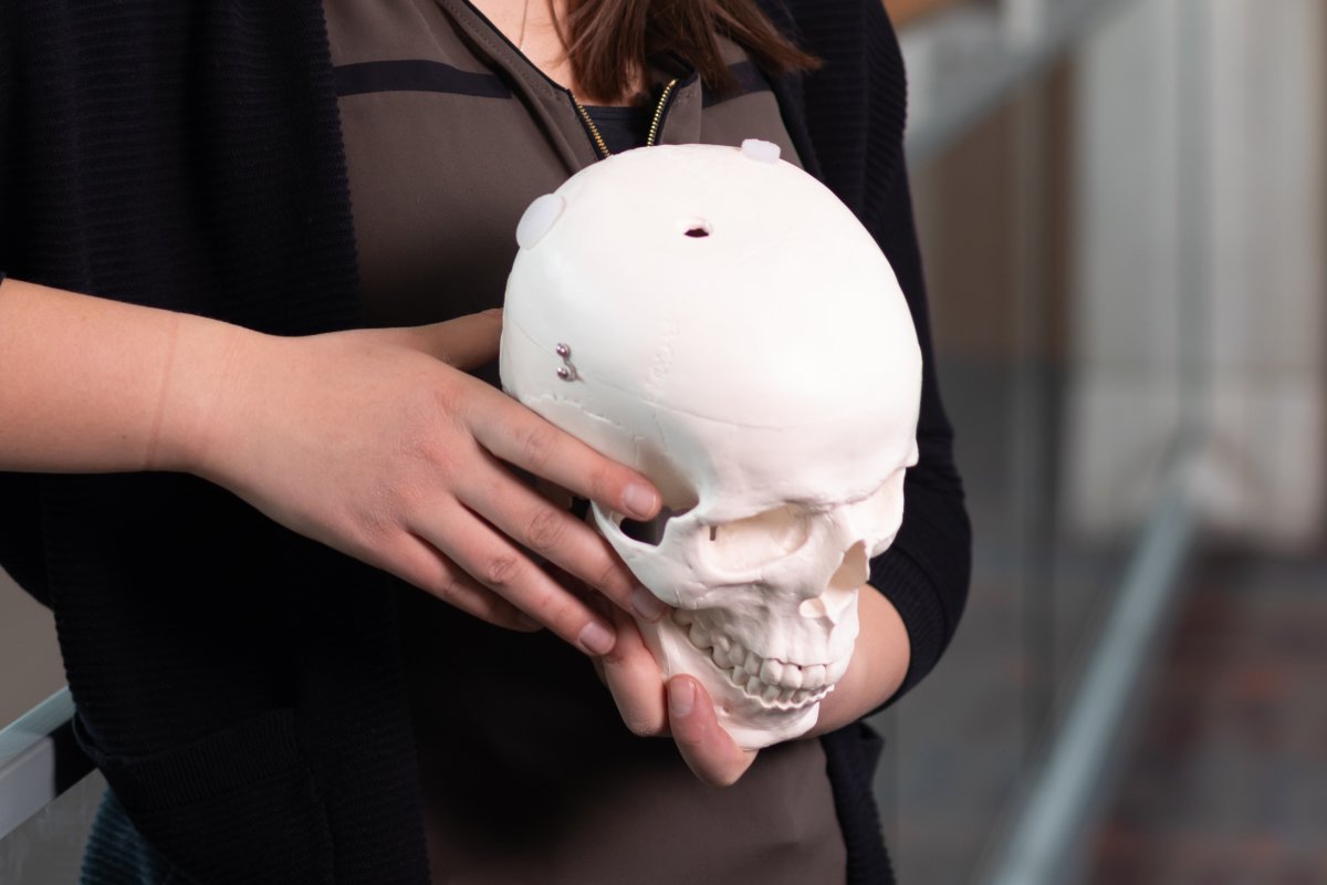 Ashtynn holding a skull in her hands.