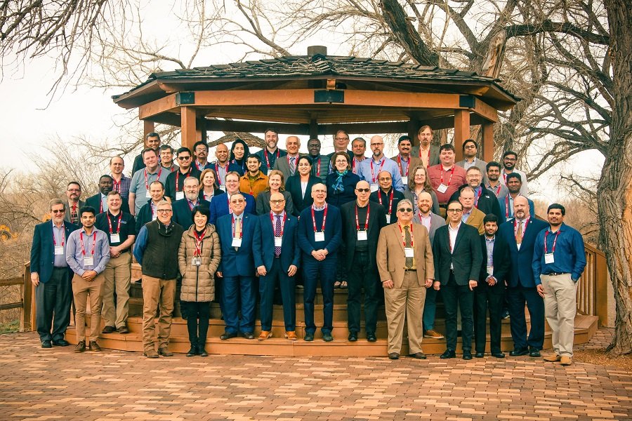 Group photo of workshop attendees standing outdoors