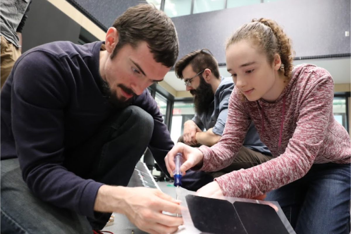 Students working on electric car