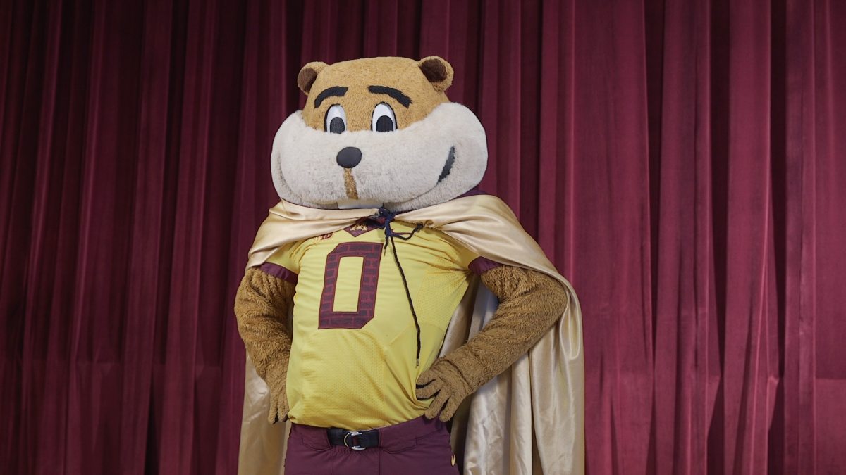 Goldy Gopher poses with a golden cape.