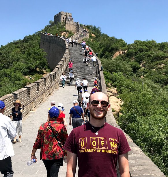 A student in front of the Great Wall of China