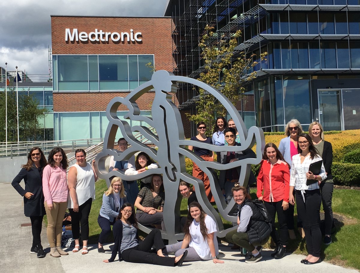 Students around sculpture in front of Medtronic building