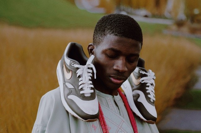 Taoheed Bayo poses with his Afro-Yute sneakers