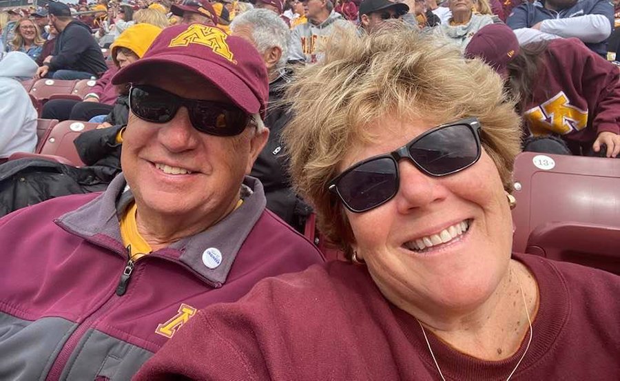 Jeff and Ann Johnson Stewart showing their Gopher Spirit at a football game