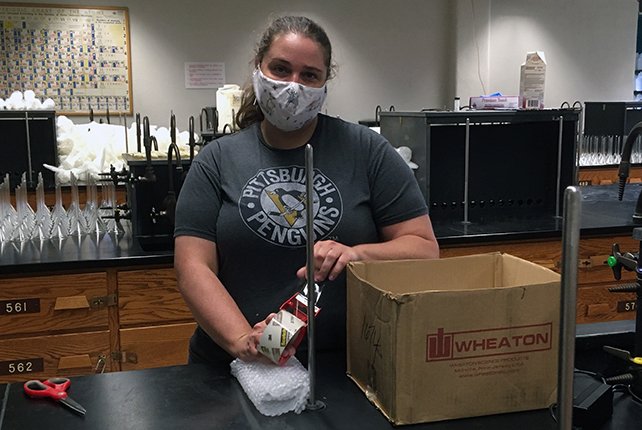 Kylie Adams packing instruments for lab kits