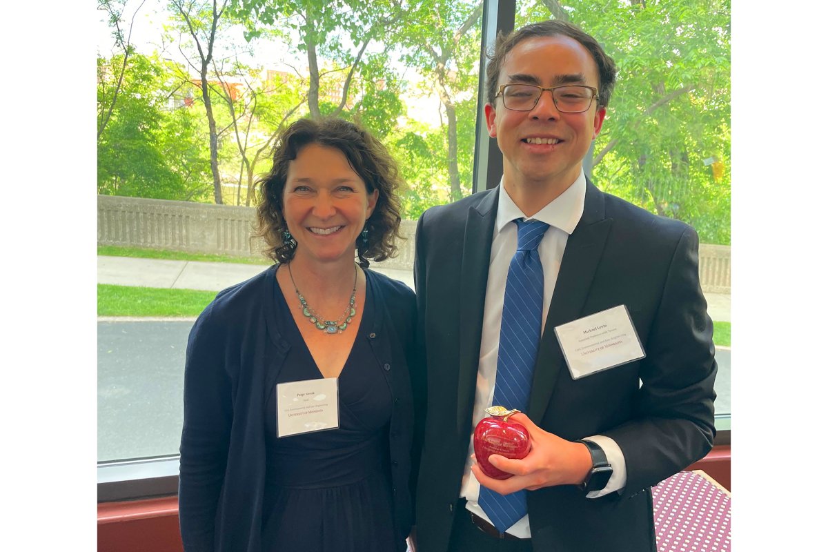 Michael Levin (right) promoted to Asst. Prof. Pictured with Dept Head Paige Novak