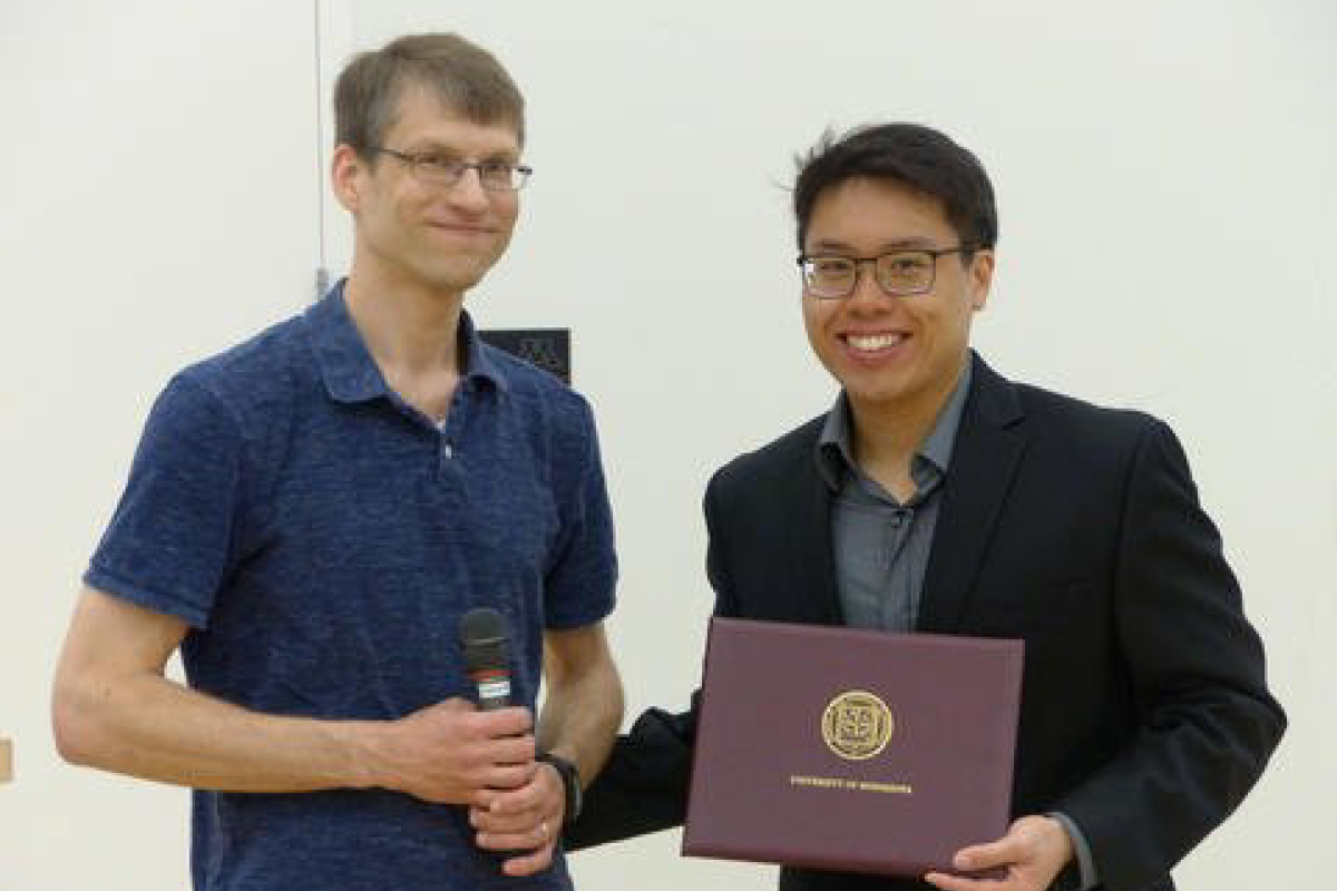 Nick Hopper presenting award at 2018 commencement