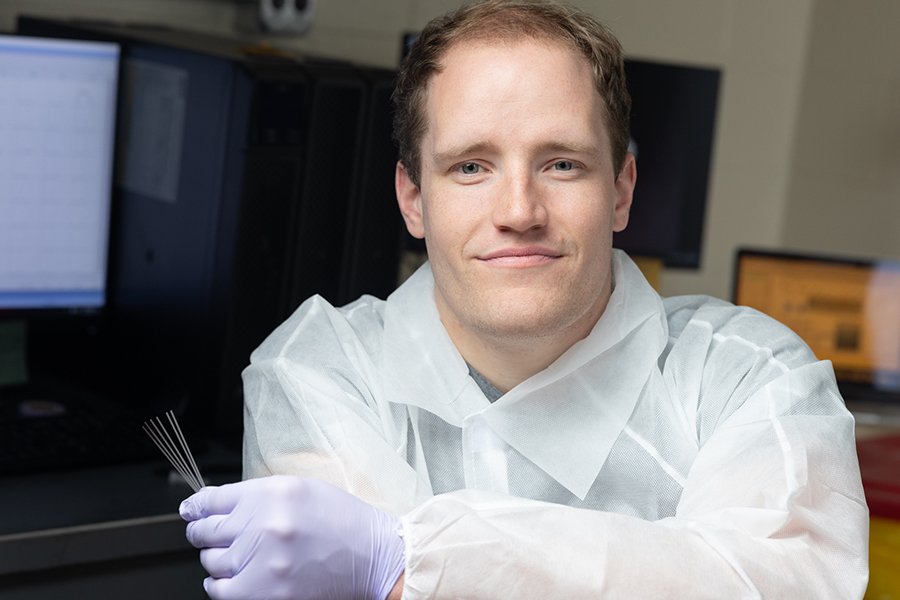 Peter Christenson, an electrical and computer engineering postdoctoral researcherholds glass capillary tubes like those used in the study.  