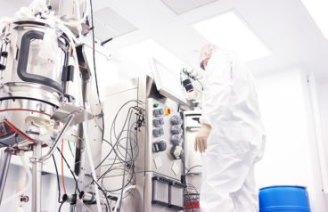 Scientist working with a bioreactor for cell culture. Pharma manufacturing requires digitalization for best results, according to experts at Emerson. 